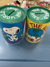 Two Snoopy Collectors Money Box’s Cardboard Case And Removable Tin Lid