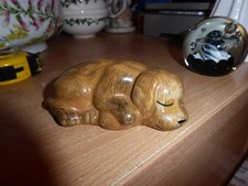 Quail sleeping dog figure