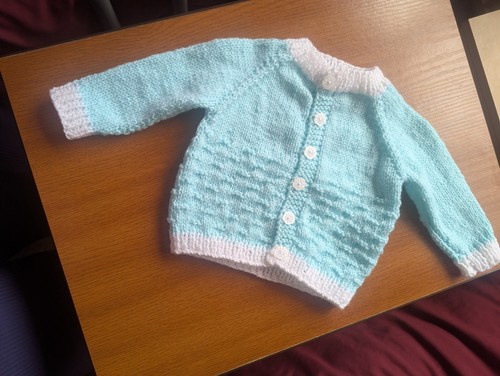 Hand knitted baby - hand,