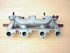 Imp Sport/ Stilletto twin stromberg inlet manifold.