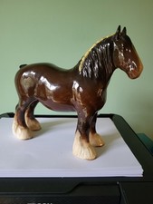 A BESWICK BROWN HORSE WITH WHITE FETLOCKS FIGURE: 8.5" LONG: VERY GOOD CONDITION