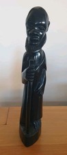 Dark wood carved figurine of African man 11.5" 29.5cm