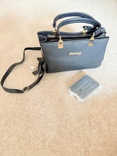 Women's new black Danbaoly handbag with gold trim, pendant and matching purse