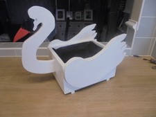 well hand made wooden swan