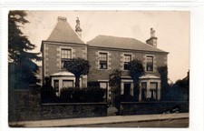 Picture postcard of a house by