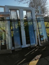 upvc french doors with side  panels and internal blinds with frame. 