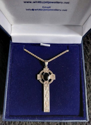 Silver caedmon cross with an - silver,