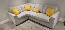 DFS Freya collection corner sofa in a light grey/silver fabric with silver feet.