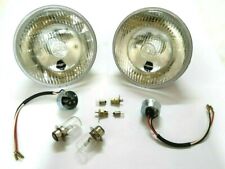 2  7"  REPRO' HEADLIGHT + PILOT LIGHT. "LUCAS" MARKED LENS. HOLDERS + BULBS