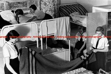 F017754 BDM girls making beds