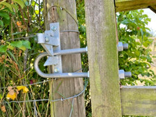 Gate latch striker for 5 bar