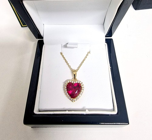 Yellow gold finished red ruby