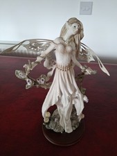 fairy in trees with flowers and toadstools figurine ornament