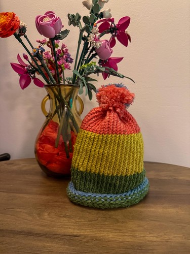 Rainbow hand knitted bobble - hand,