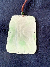 Chinese carved jade pendant with a dragon and phoenix