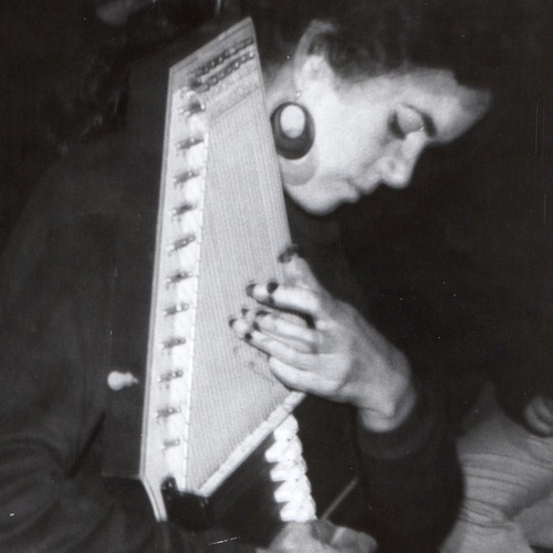 C1970s woman playing autoharp - playing,