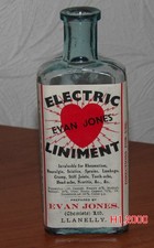 ANTIQUE  BOTTLE POWERFUL ELECTRIC  LINIMENT PICTURE -JONES CHEMISTS LLANELLY