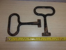 Pair of vintage metal manhole lifters
