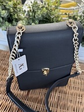 Black Leather Bag With Chain  Handle Detail.