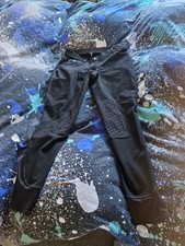 Jodhpurs with Rubber thighs and buttocks. Black with cream trim seams. Size 16. 