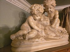 Large cherub statue