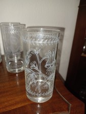 A variety of cut glass and etched glass, drinking glasses