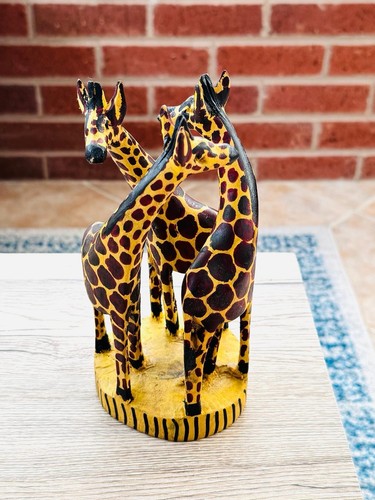 Hand carved wooden giraffe - hand,