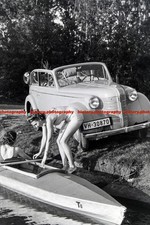 F000509 Young woman getting inside a boat Klepper T6 on a lake BdM Germany 1930s