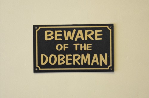 Beware the doberman sign or - of,