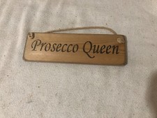 wooden palque written PROSECCO QUEEN rope wall hanging 