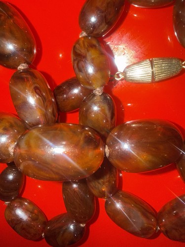 Amber coloured bakelite - coloured,