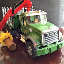 Bruder 02824 MACK Granite Timber truck with loading crane, grab & 3 trunks 1:16