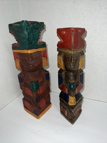 Two wooden totem poles hand - poles,