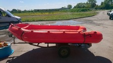 Whaley Unpowered Dinghy on road/launch trailer. 12ft long X 5ft 8'' wide.