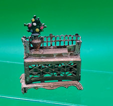 DOLLS' HOUSE ANTIQUE GERMAN SOFT METAL ORNATE FURNITURE PIECE WITH VASE FLOWERS