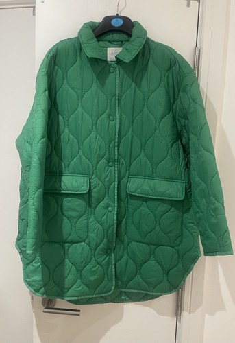Green quilted jacket worn - quilted,