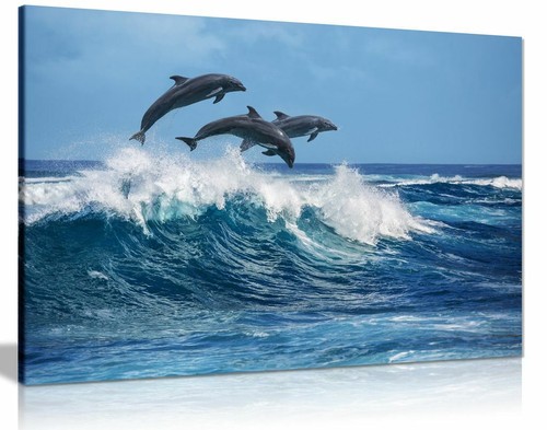 Dolphins jumping over blue - over,