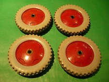 Four Meccano plastic red/grey