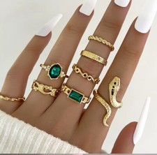 Ladies girls 8 piece ring set.  Golden or Silvery choice.  Free postage,