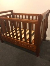 cot and toddler bed with