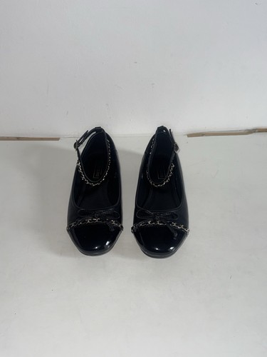 Black ballet flats with gold