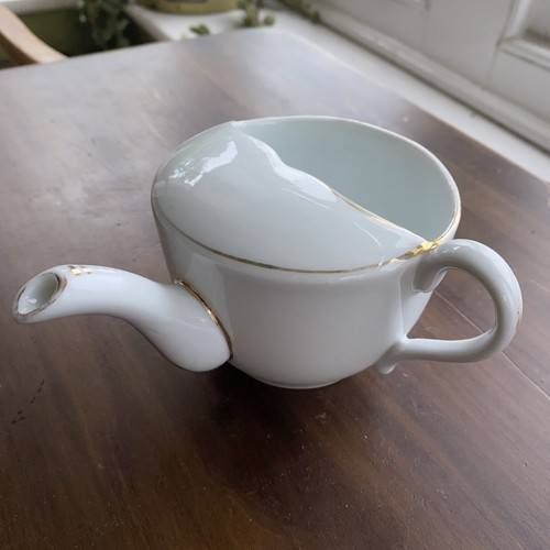 Invalid feeder cup with - , handle