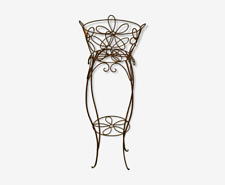 Tall wrought iron planter with a flower motif / plant stand