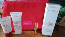 Clarins Beauty Products Set Of 4 Plus Cosmetic bag