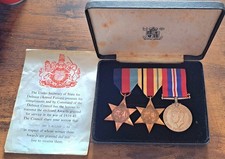 Set of three British World War II medals in a presentation box.