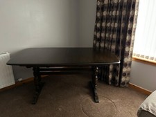 Ercol Extending Ercol dark oakDining Table and four chairs and two carvers. 