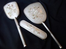 Three piece dressing table vanity set, silver plated, mirror, brush and clothes
