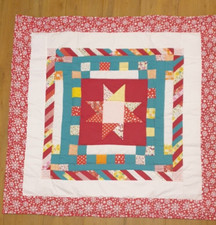 Lap or cot quilt with red snowflake and red star sz 98 x 100cm