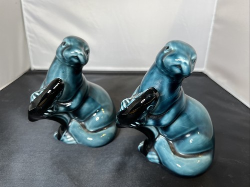 Poole pottery otters with - otters,