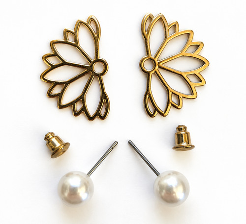 Gold tone floral ear - tone,